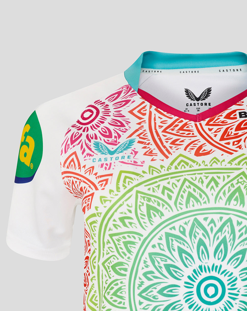 Colorful sports jersey with intricate patterns and brand logos on a light gray background