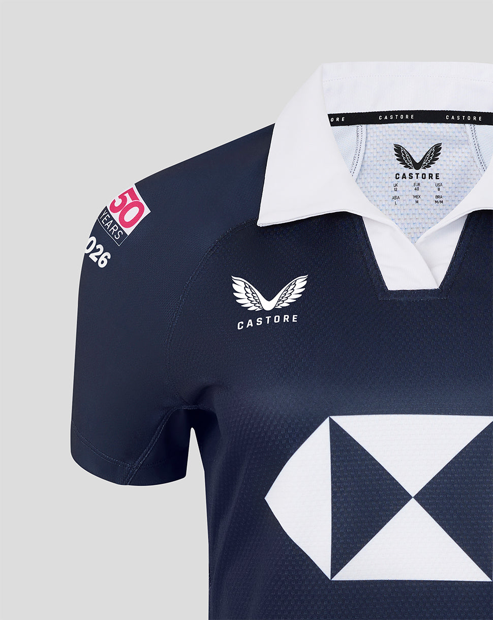 Navy sports jersey with white accents and visible branding on a light gray background