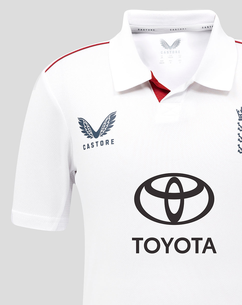 White polo shirt with Castore and Toyota logos on a gray background