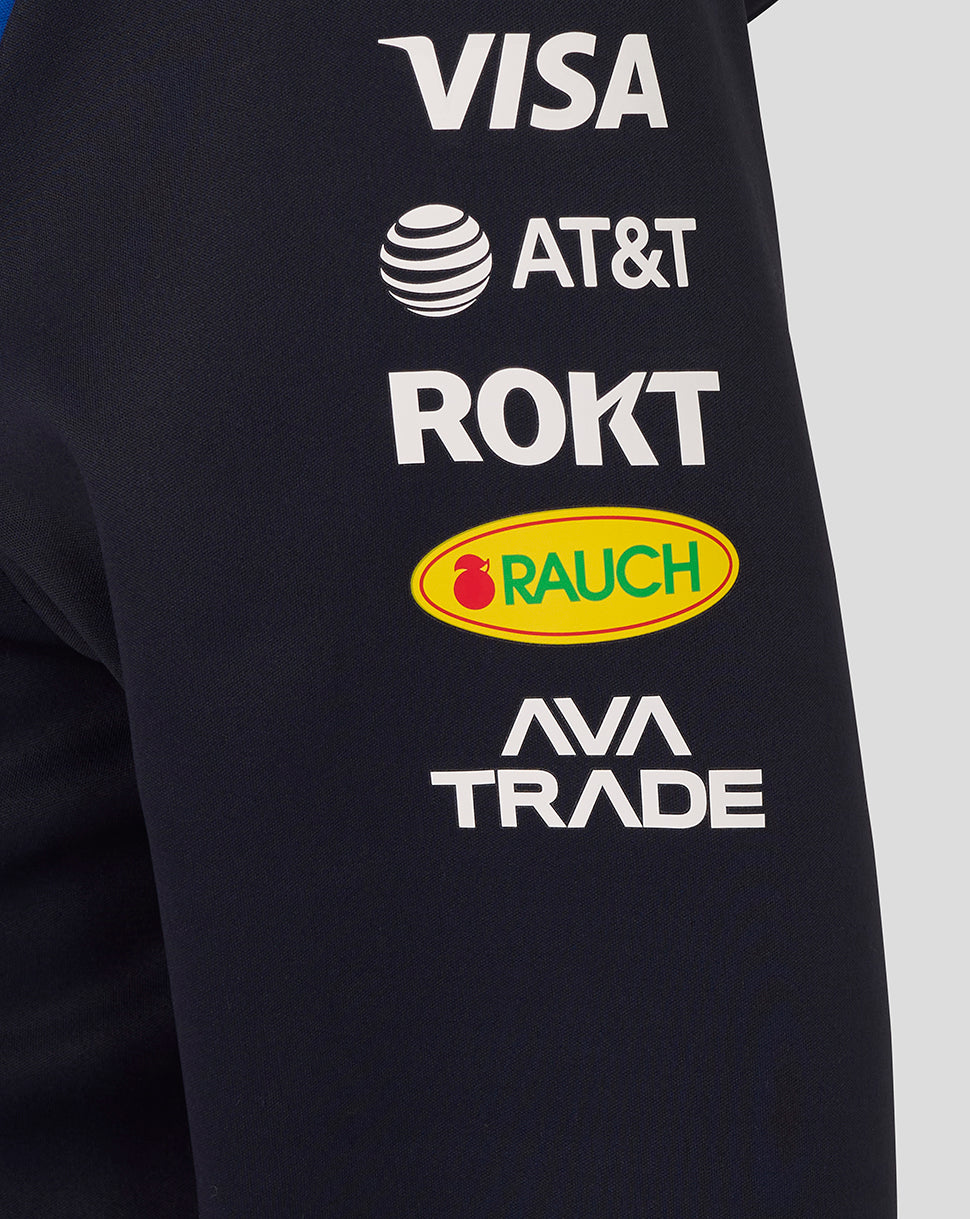Black shirt with various brand logos including Visa, AT&T, ROKT, Rauch, and Ava Trade.