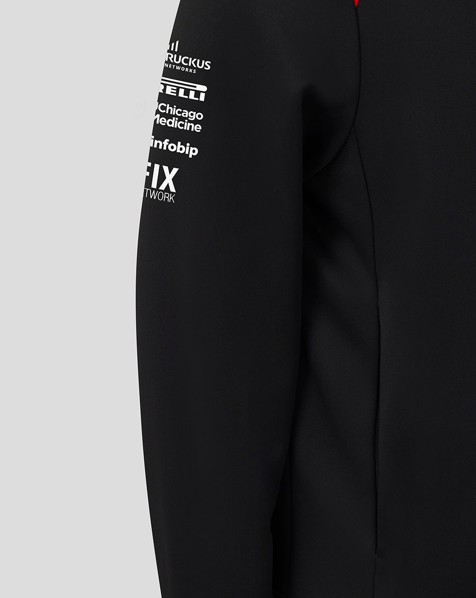Black jacket with white text logos on a gray background