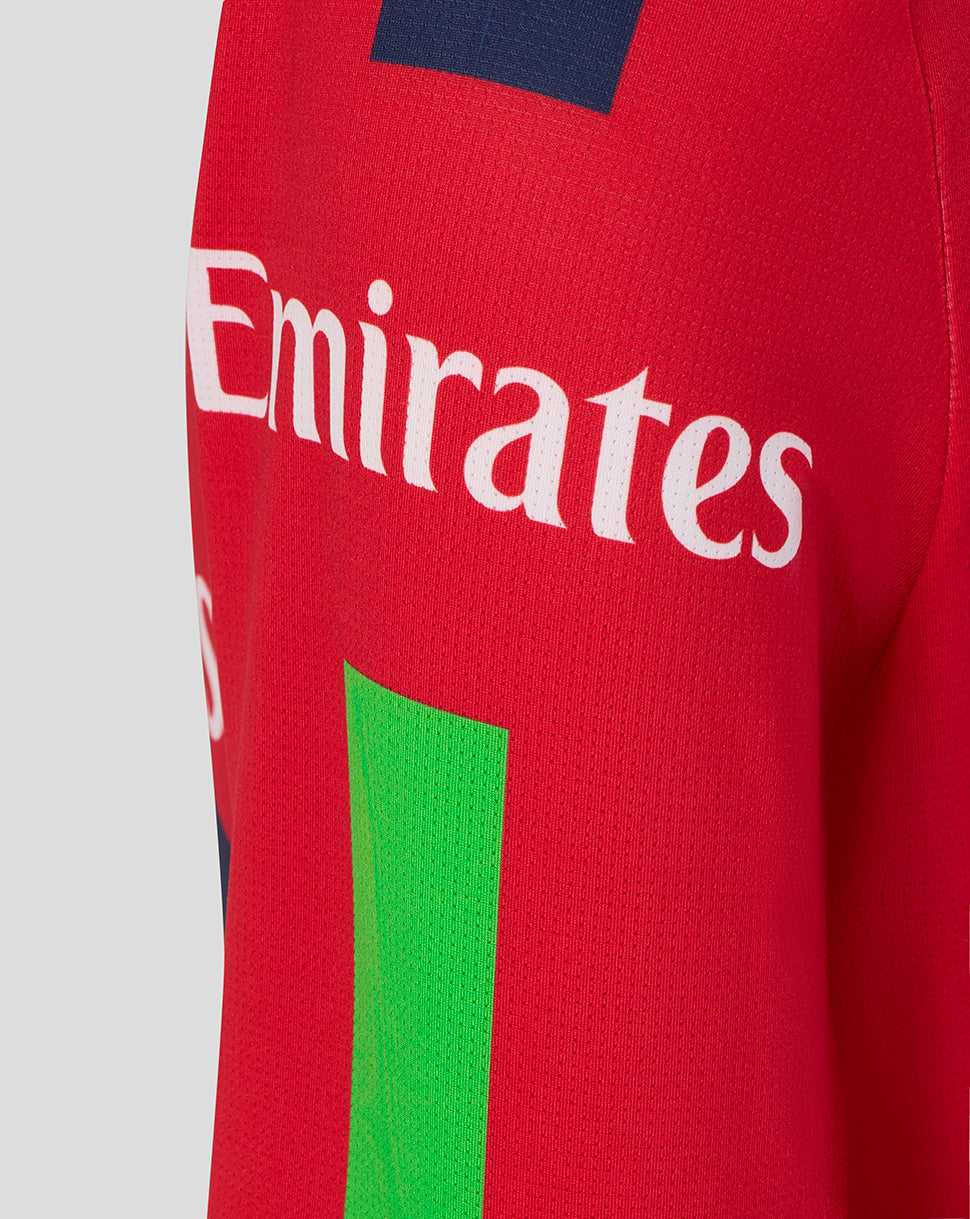 Red sports jersey with Emirates logo and green stripe on a light gray background