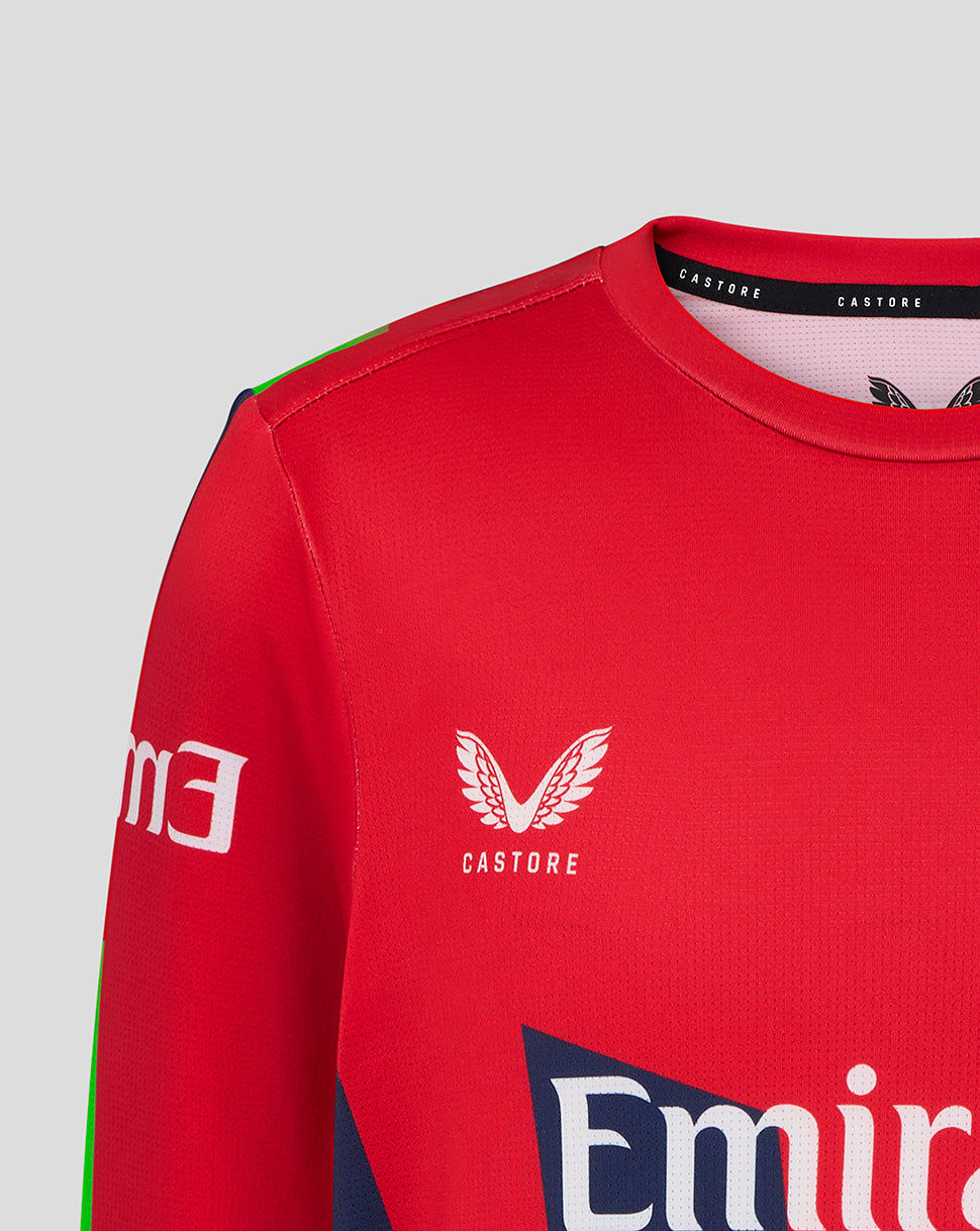Red sports jersey with Castore and Emirates logos on a gray background