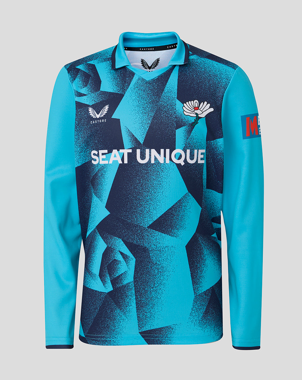 Blue long-sleeve shirt with geometric pattern and visible branding on a gray background