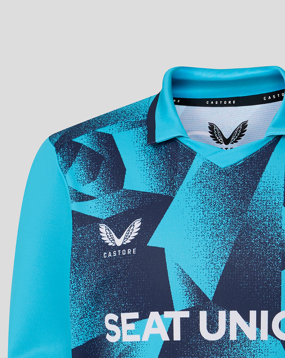 Blue and black sports jersey with 'Castore' branding on a gray background