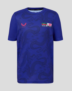 Blue sports jersey with dragon design and branding on a gray background