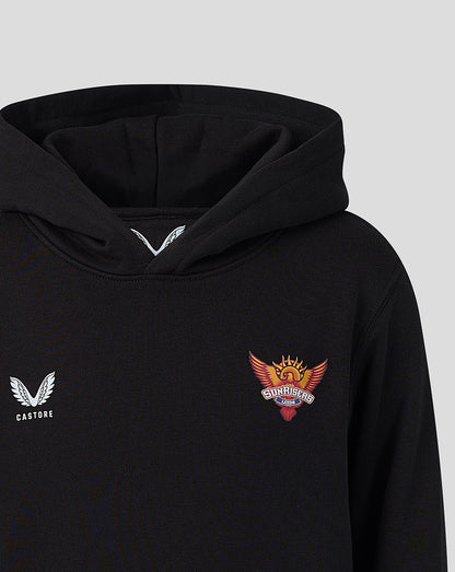 Close up of black juniors hoodie with Castore logo on the left chest and Sunrisers Leeds crest on the right under the hood