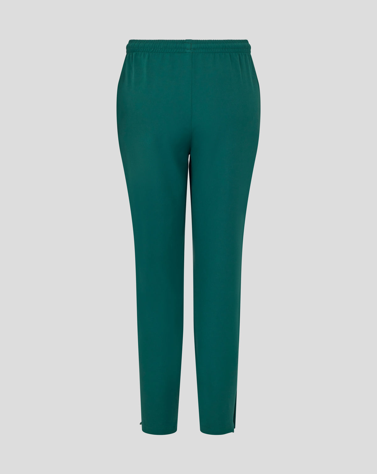 Front view of botanical green junior training track pants with white wing logo on the thigh.