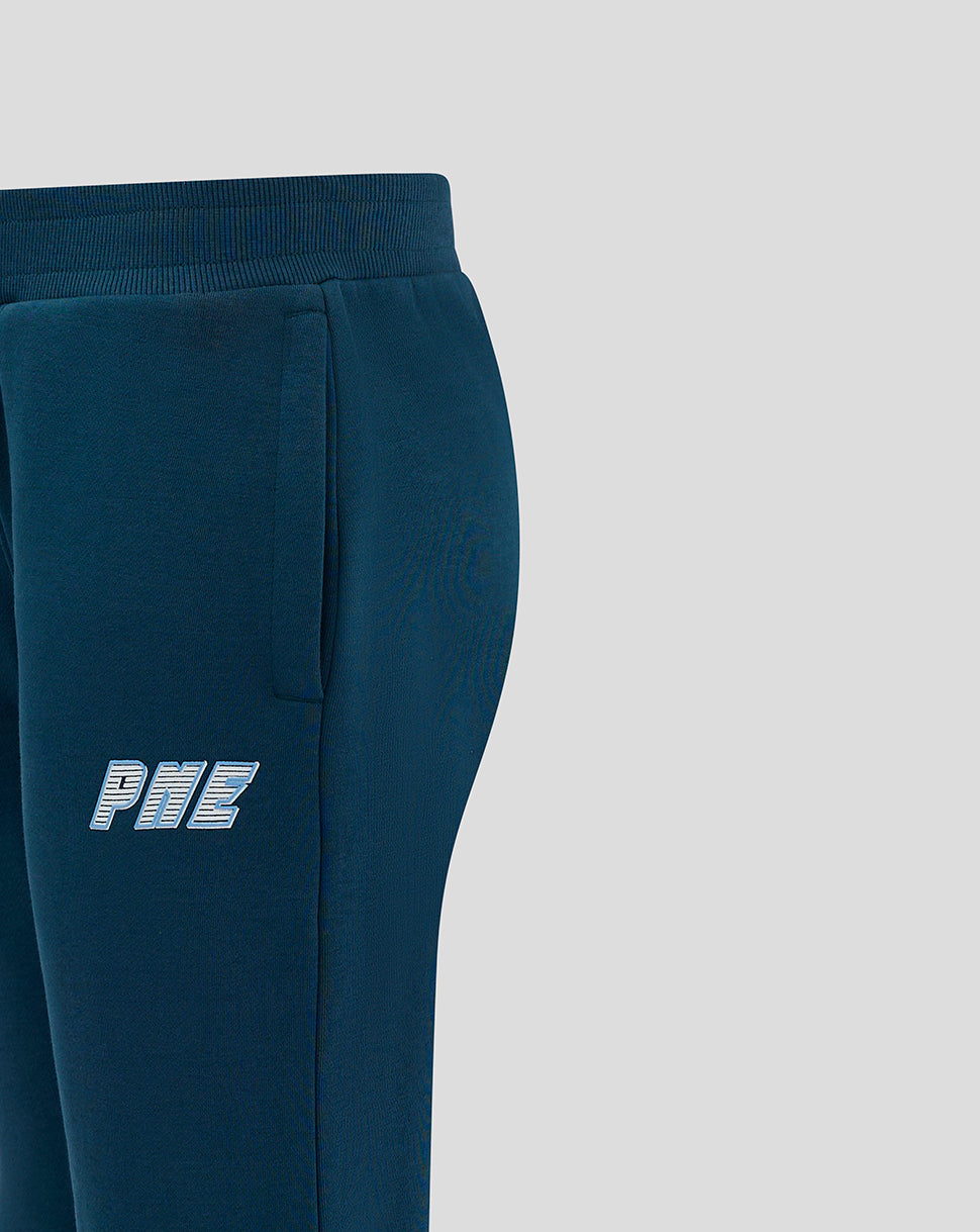 Close up of the dark blue joggers showing the side pocket and logo on the thigh.