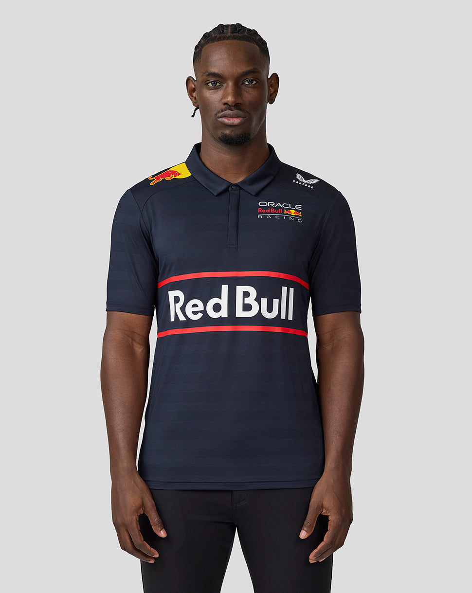 Front view of a man in a navy Red Bull polo shirt with a bold Red Bull logo across the chest