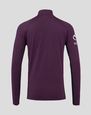 Purple long-sleeve shirt with a brand logo on the sleeve against a light gray background