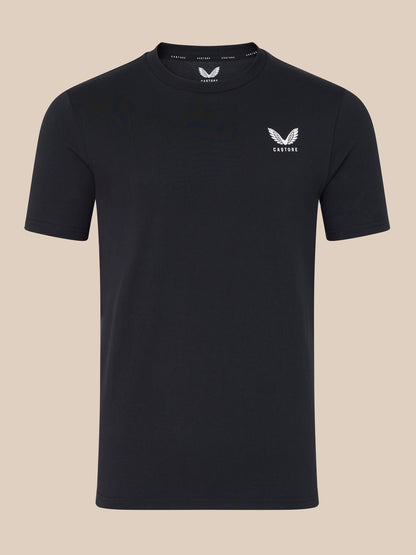 Black t-shirt with a logo on a beige background