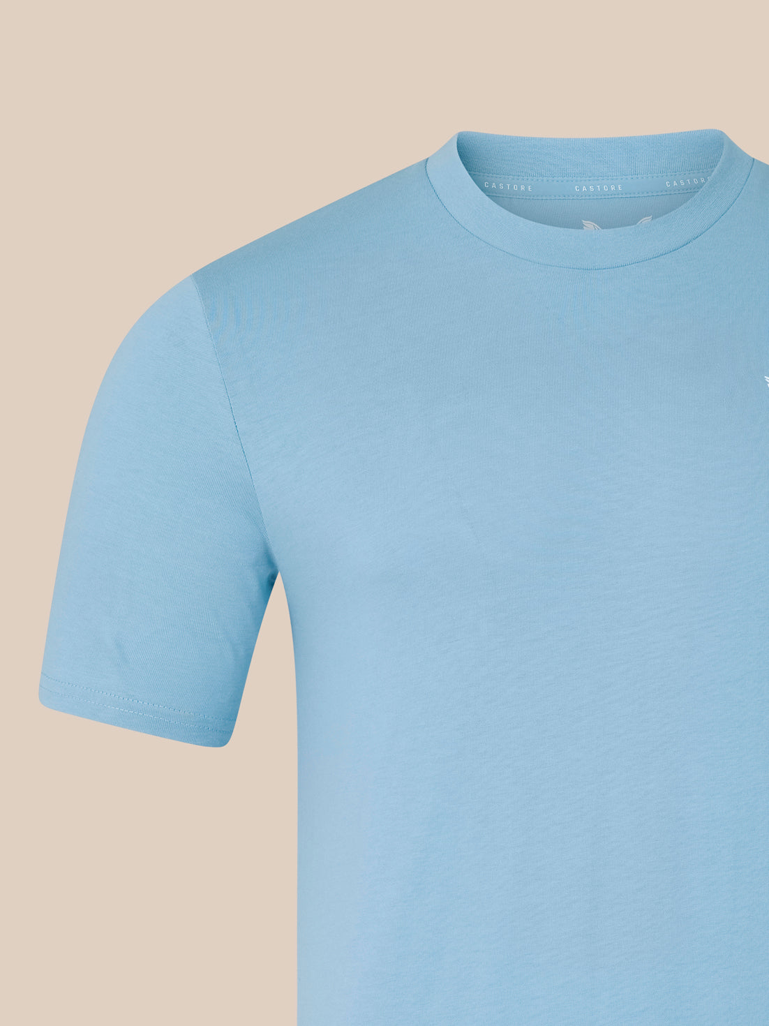 Light blue t-shirt on a beige background