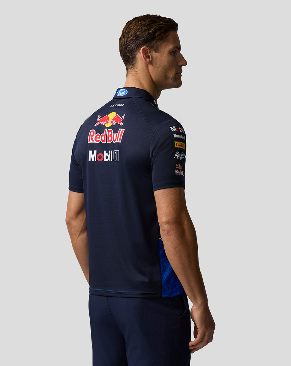 Person wearing a navy blue sports jersey with Red Bull and Mobil 1 logos on a light gray background