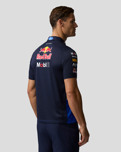 Person wearing a navy blue sports jersey with Red Bull and Mobil 1 logos on a light gray background