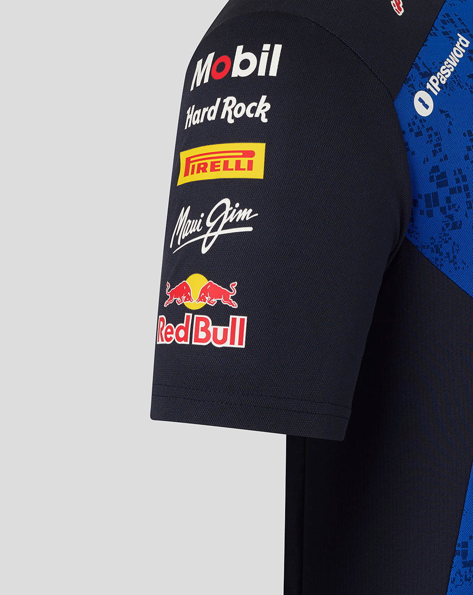 Close-up of a black sleeve with various brand logos on a gray background