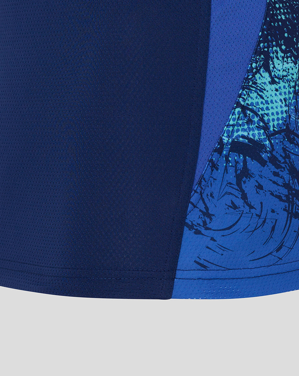 Blue athletic shorts with a patterned design on a light gray background
