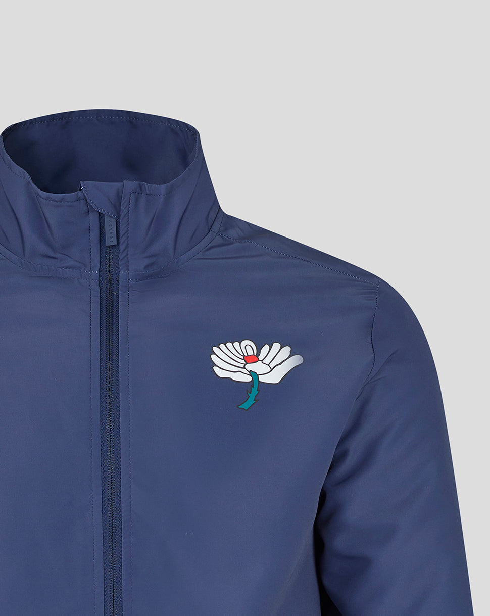 Blue jacket with a white logo on a light gray background