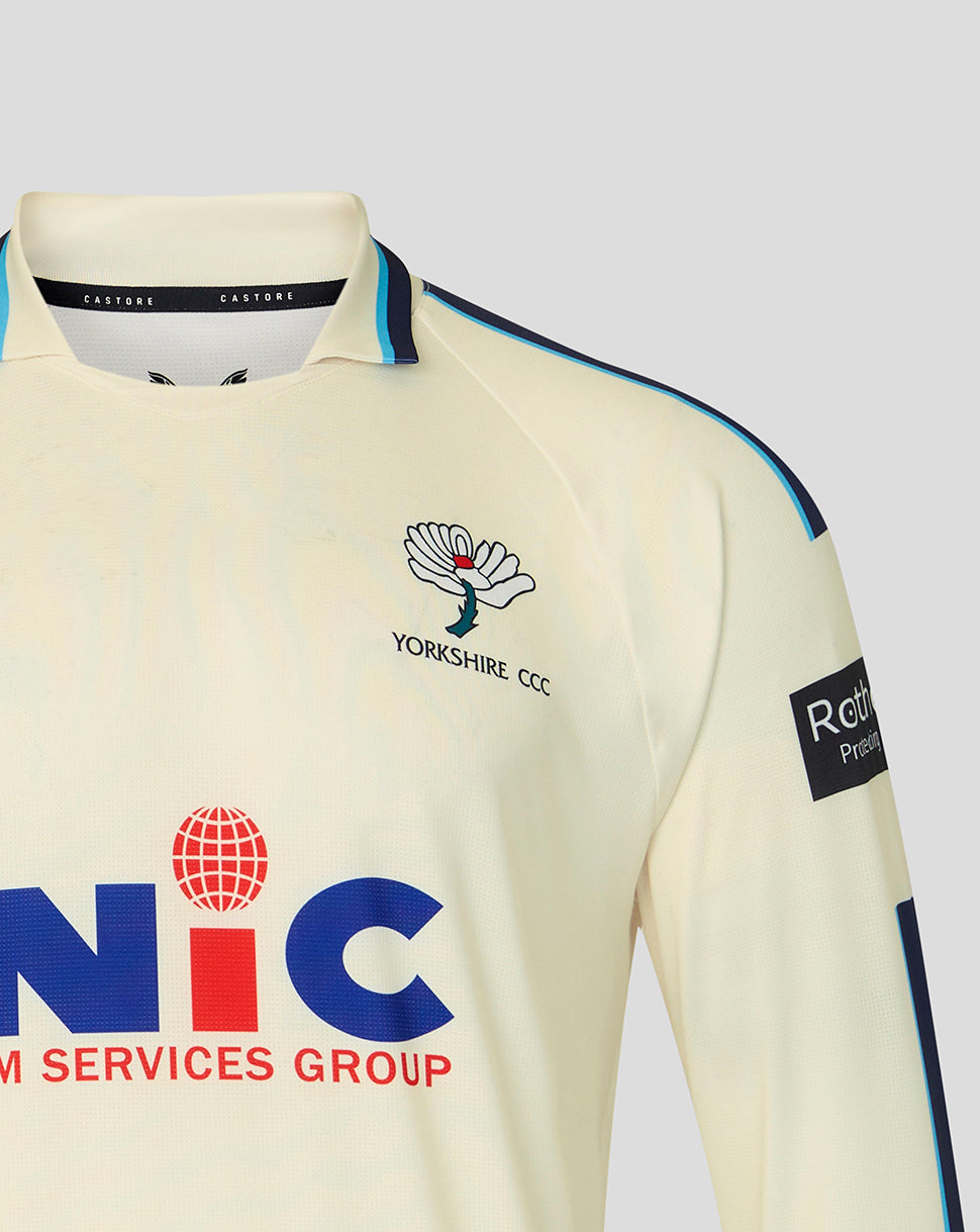 Cream-colored sports jersey with logos on a light gray background