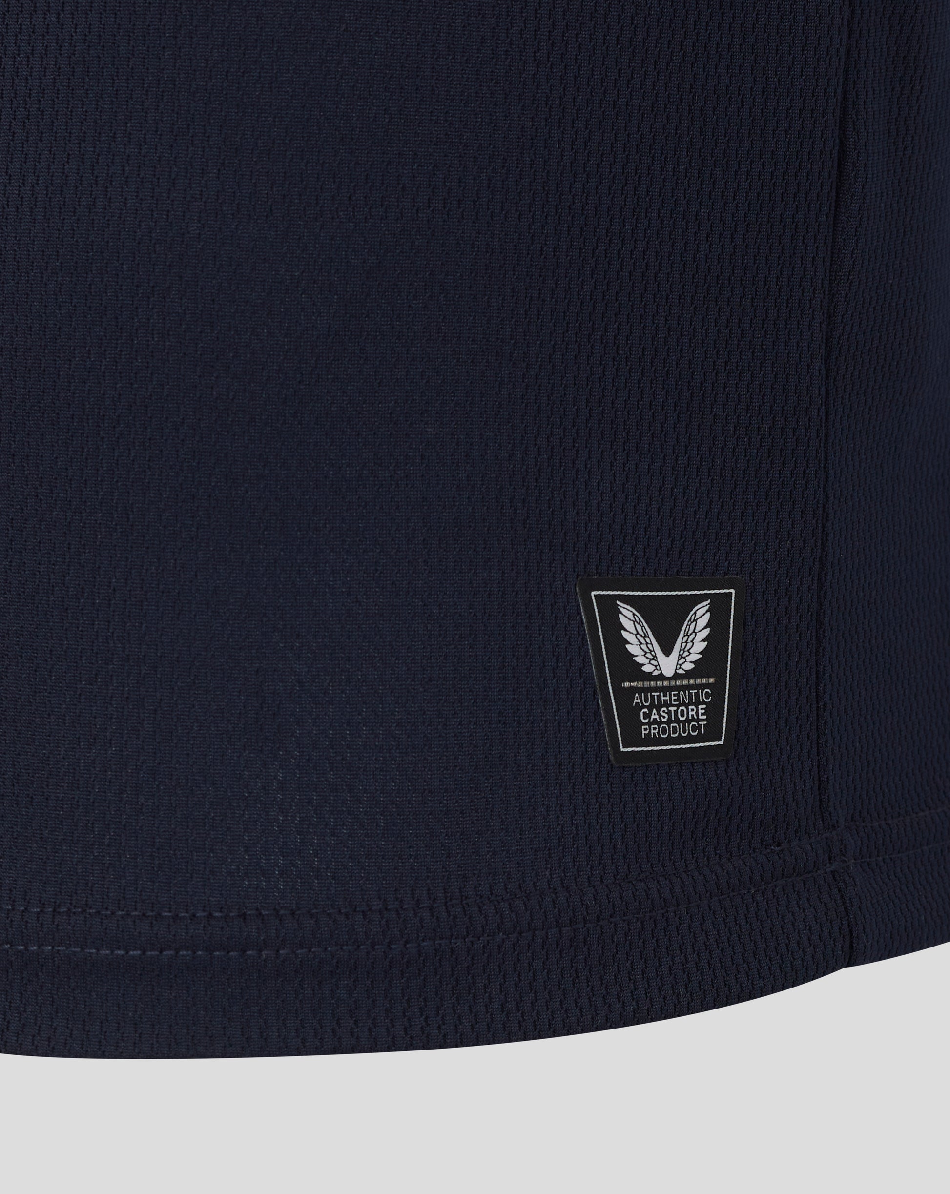 Navy blue shorts with a brand logo on a light gray background