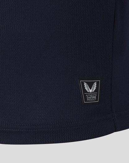 Navy blue shorts with a brand logo on a light gray background
