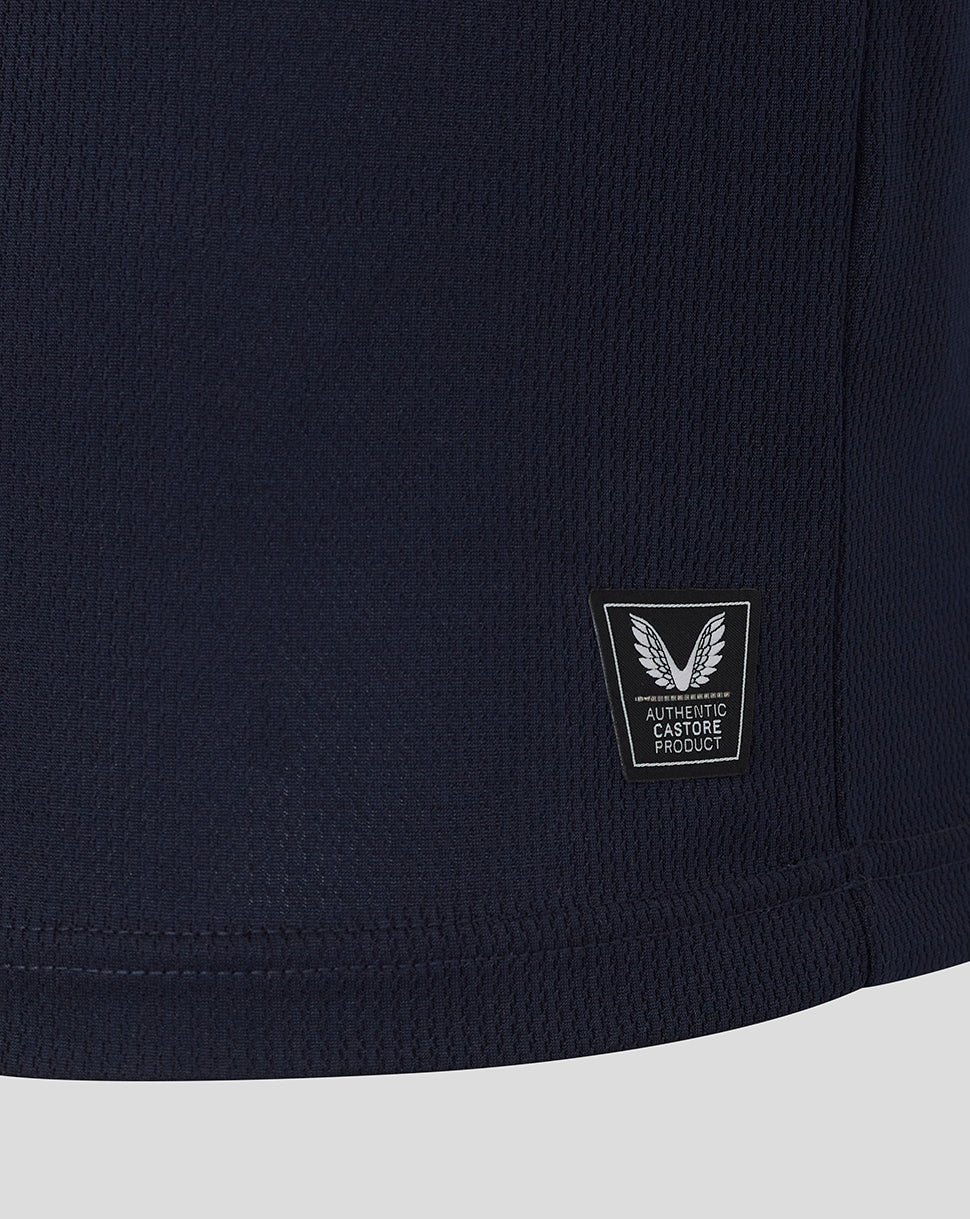 Navy blue shirt with a brand logo on a light gray background