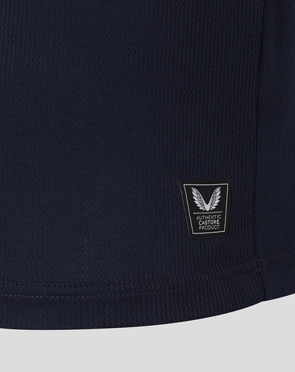 Navy blue shirt with a brand logo on a light gray background