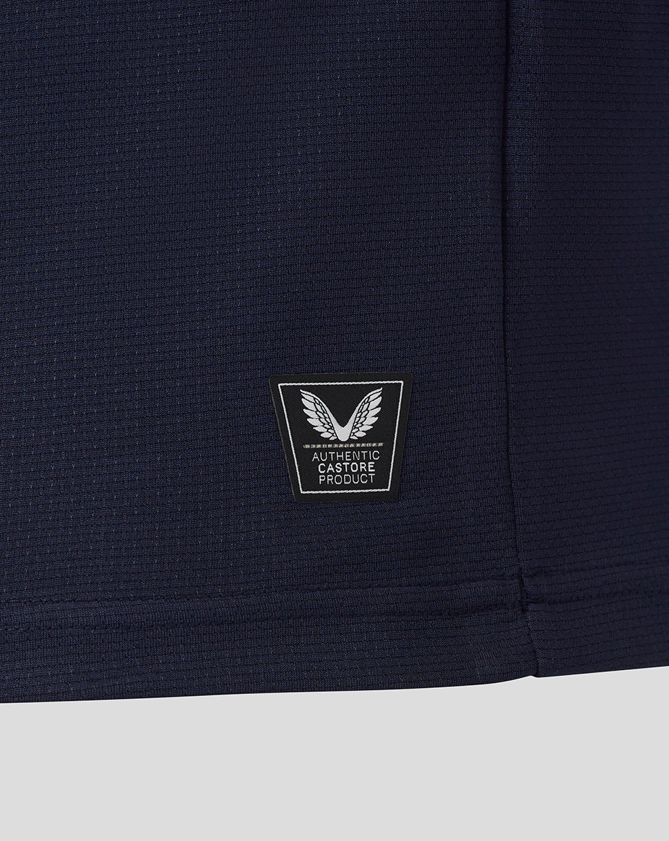 Navy blue fabric with a logo patch on a white background