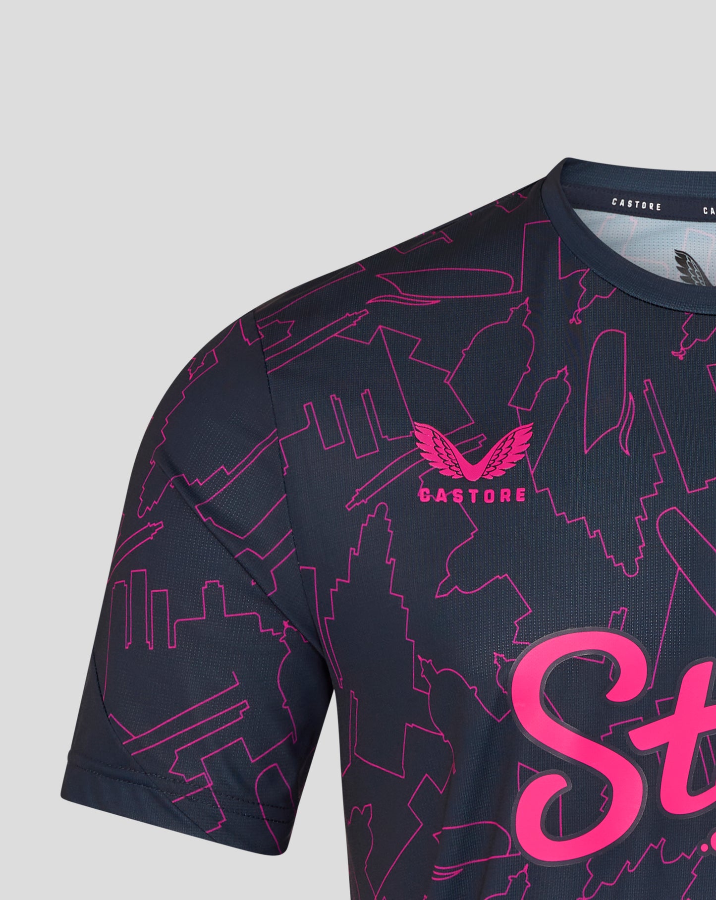 Black sports jersey with pink graphics and branding on a light gray background