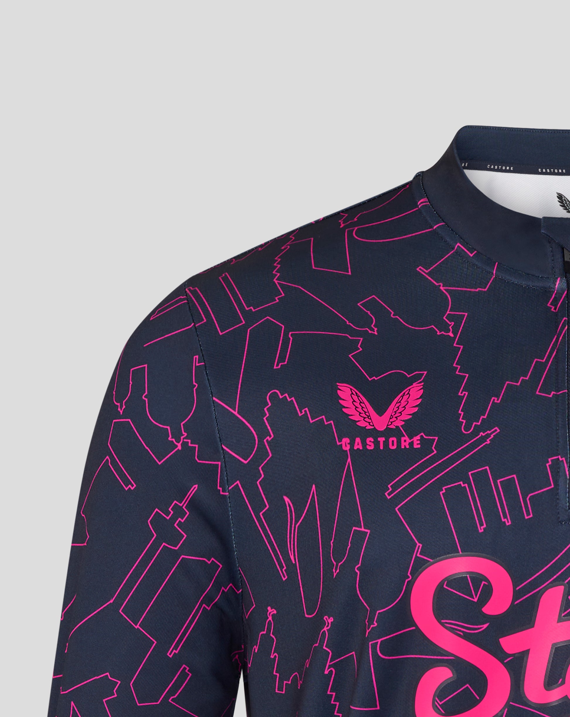 Navy blue shirt with pink geometric patterns and logo on a light gray background