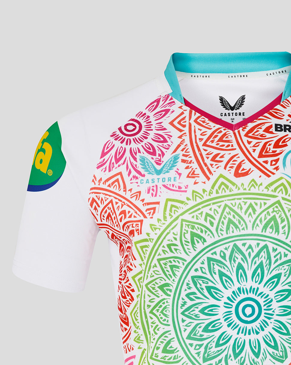 Colorful sports jersey with intricate patterns and brand logos on a white background