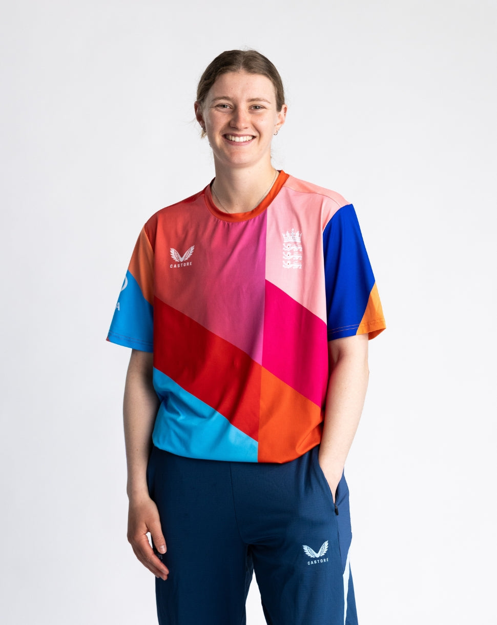 Person wearing a colorful sports outfit with a white background