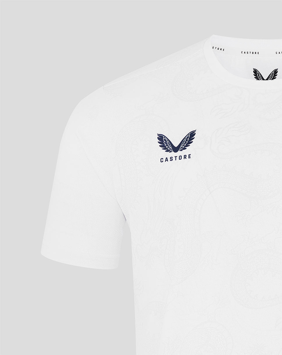 White t-shirt with a logo and text on a light gray background