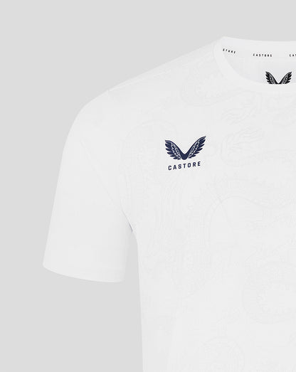 White t-shirt with a logo and text on a light gray background