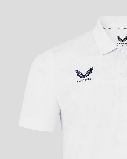 White polo shirt with a logo on a light gray background