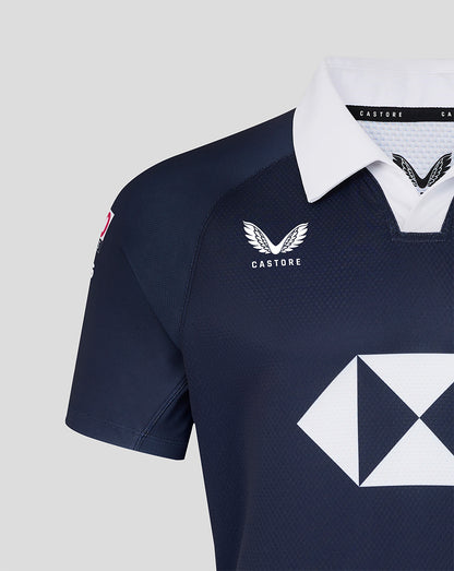 Navy sports jersey with white accents and branding on a light gray background