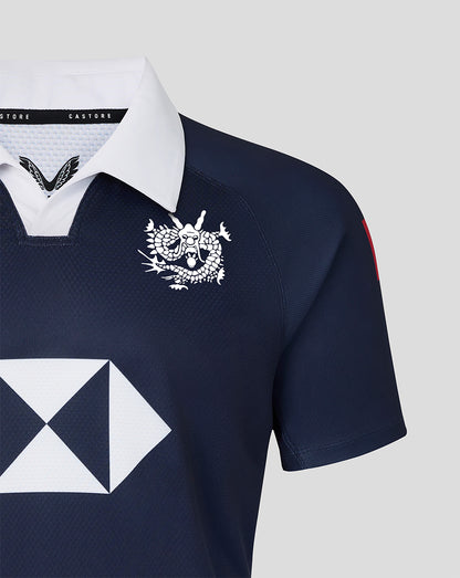 Navy rugby jersey with white collar and emblem on a light gray background