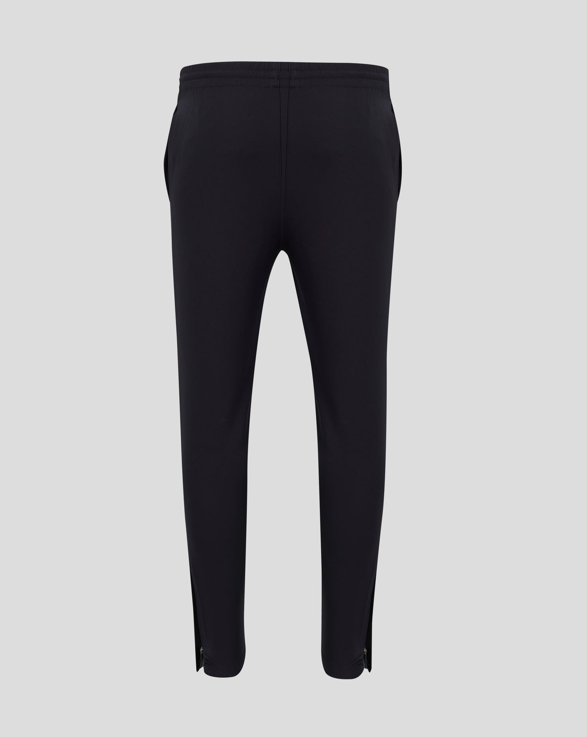 Back waist area showing a pocket seam on black track pants.