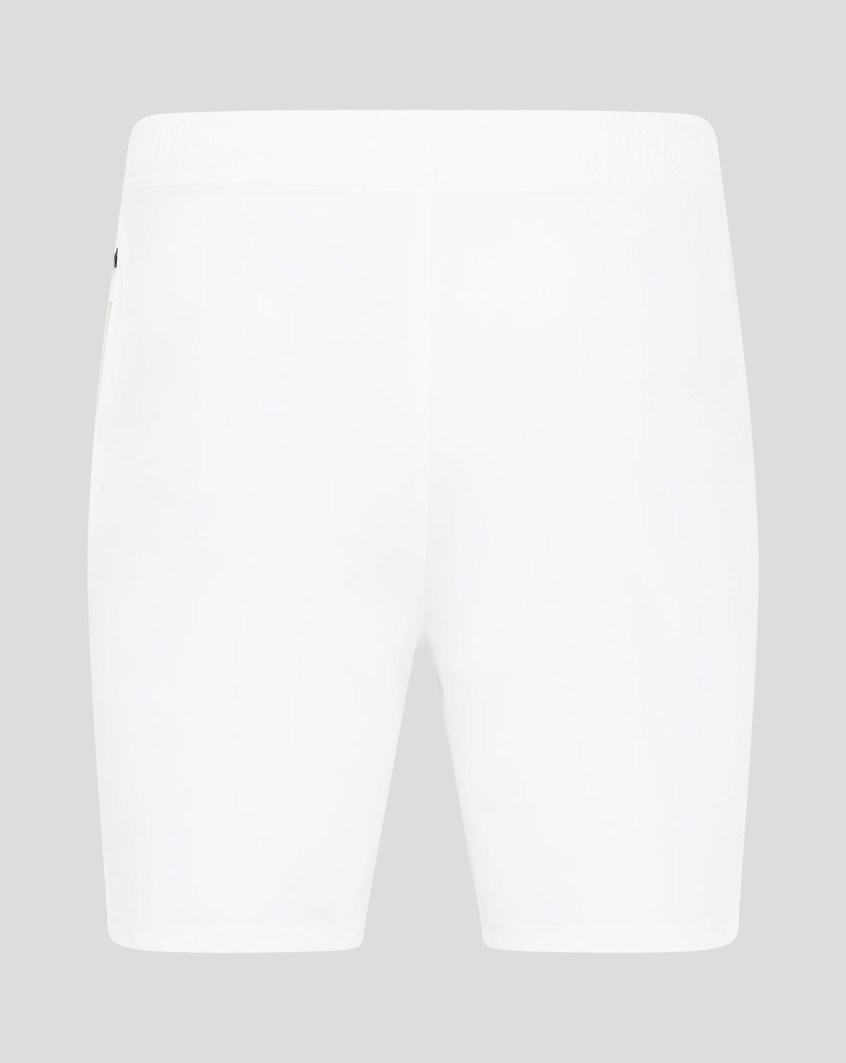 Close-up of the waist area of white woven training shorts