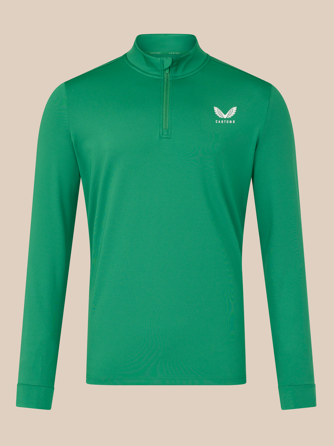 Green long-sleeve shirt with a brand logo on a beige background