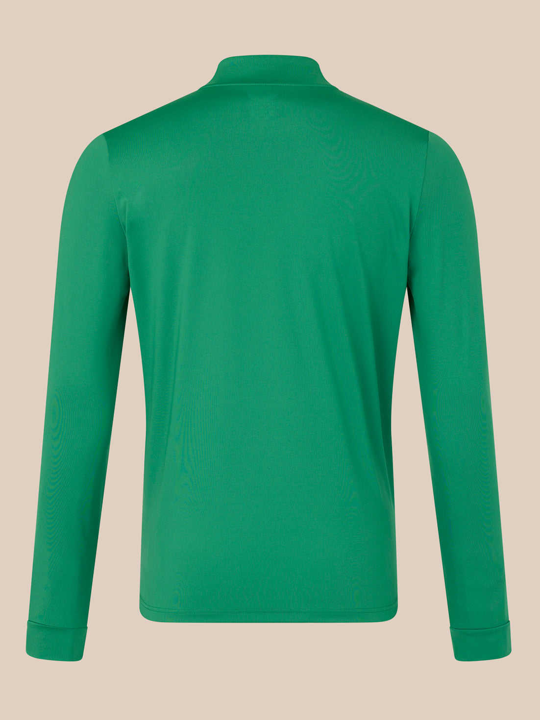 Green long-sleeve shirt on a beige background