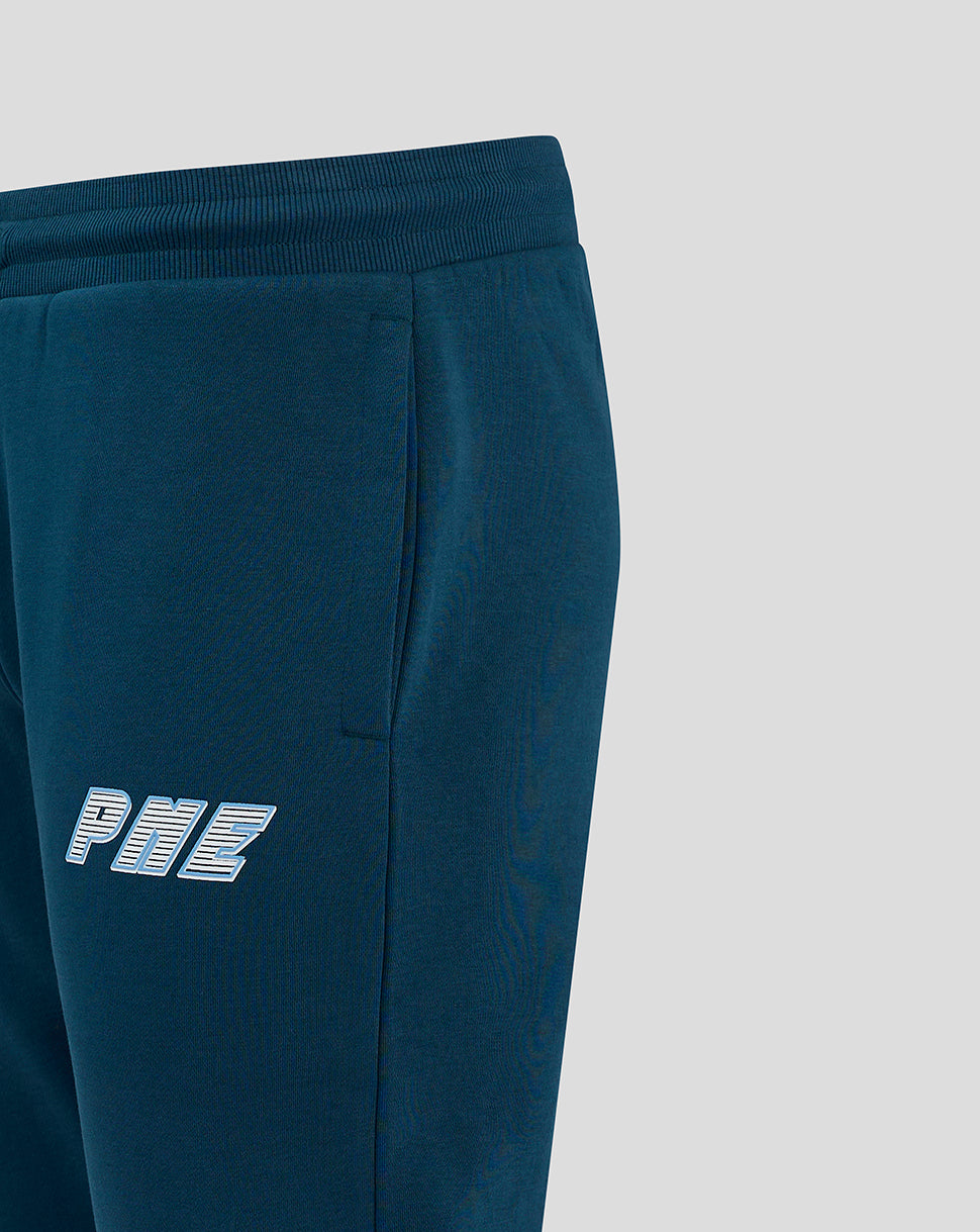 Close-up of dark blue joggers showing a rear welt pocket and PNE logo on the thigh