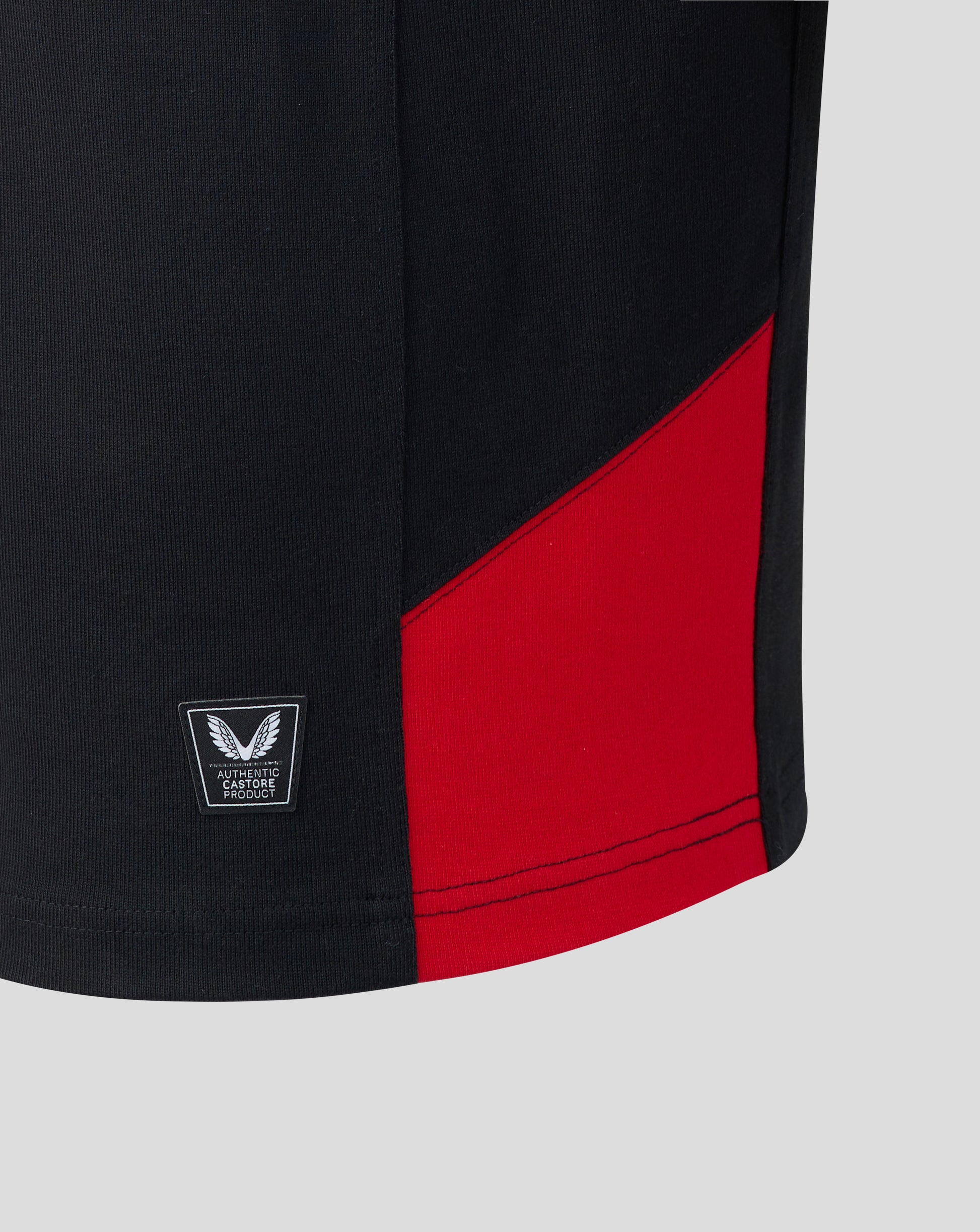 Black and red athletic shirt with a brand logo on a light gray background