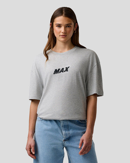 Person wearing a gray t-shirt with 'MAX' print and blue jeans on a light gray background
