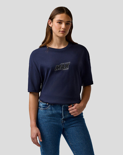 Person wearing a navy blue t-shirt with text and jeans on a light gray background