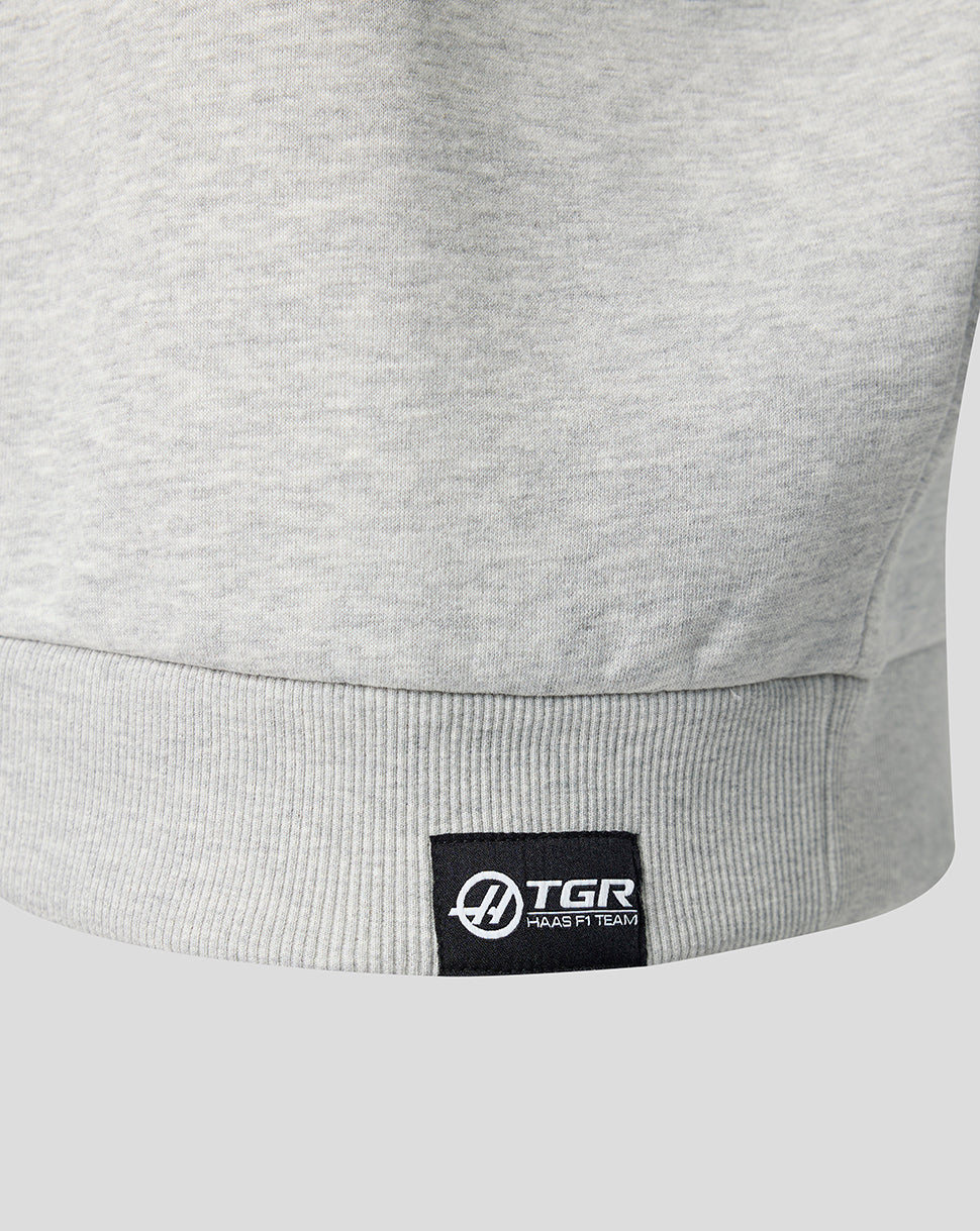 Camiseta oficial del equipo Haas unisex con gráfico lineal del monograma en la espalda y cremallera de un cuarto - Gris jaspeado - Gris jaspeado