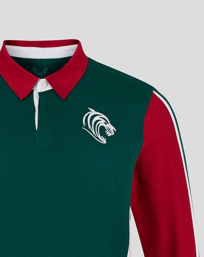 Green and red sports jersey with a logo on a light gray background