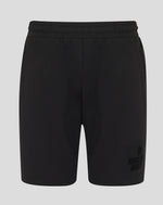 Black shorts with a brand logo on a light gray background