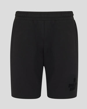 Black shorts with a brand logo on a light gray background