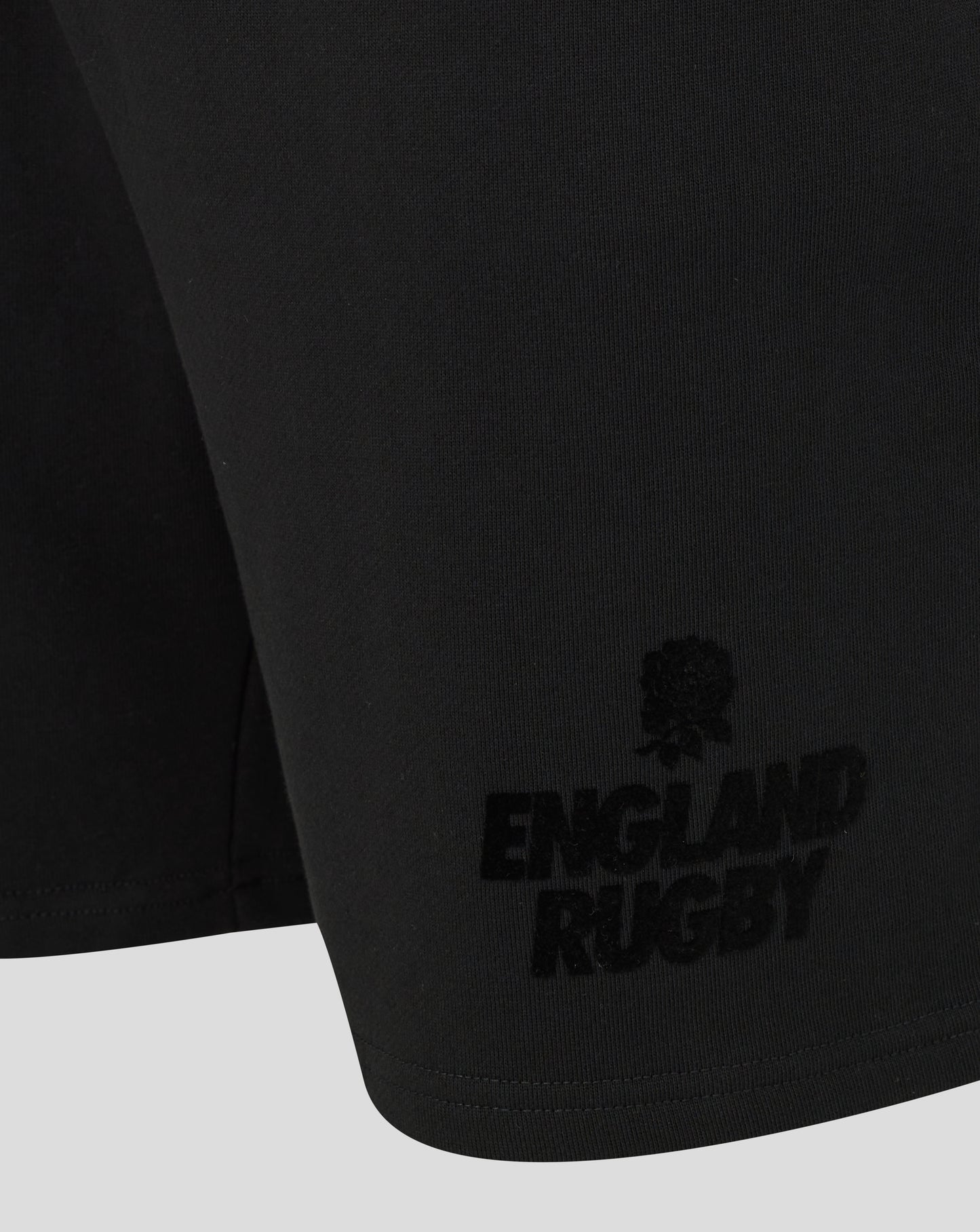 Black shorts with 'England Rugby' logo on a white background